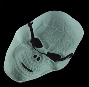 Detailed view of the glowing skull mask for Halloween party and cosplay costume events.