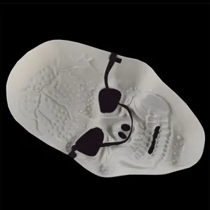 White plastic skull mask with black elastic strap for Halloween party costume details.