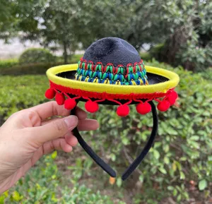 Detailed view of the colorful Mexican sombrero headband with pom poms for festive parties.