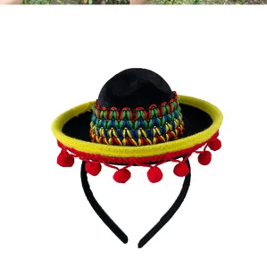 Mini Mexican sombrero headband detail, colorful woven pattern and red pom-poms, party decor.