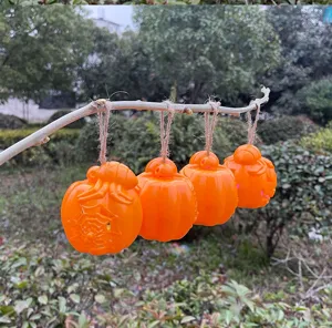 Halloween pumpkin hanging lights set for party decoration, glowing LED autumn ornaments.