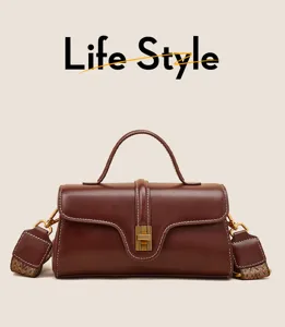 Close-up details of the premium leather handbag, showcasing the elegant clasp and stitching.
