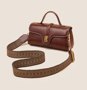 Genuine leather shoulder bag for women, stylish top-handle messenger bag with wide strap.