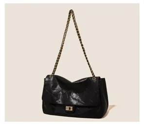 Black quilted chain shoulder bag, vintage commuter tote handbag for women details.
