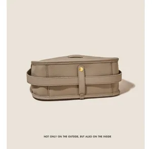 Elegant taupe leather shoulder bag for women, stylish horizontal design with durable metal hardware.