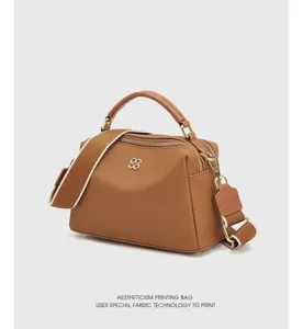 Genuine leather top-handle pillow bag, stylish brown shoulder messenger bag for women.