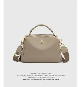 Genuine leather top handle pillow shoulder bag for women, stylish gray crossbody handbag.