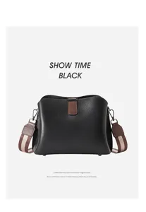 Borsa a secchiello in pelle nera da donna, elegante borsa a tracolla con dettagli marroni.