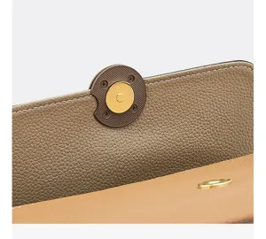 Close-up of the premium cowhide leather handbag magnetic snap closure with fine stitching details.