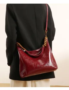 Red patent leather hobo shoulder bag for women, large capacity stylish casual crossbody bag.