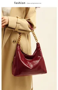 Stylish red patent leather shoulder bag with gold chain, elegant women hobo handbag.