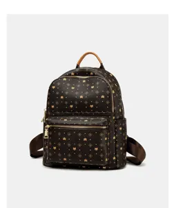Close-up detail of the stylish brown monogram backpack featuring premium leather and gold hardware.