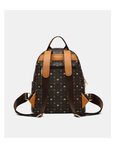 Detail view of brown monogram women's backpack, featuring shoulder straps and hardware.