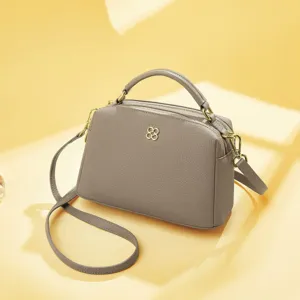 Genuine leather handbag for women, stylish top-layer cowhide crossbody pillow bag with gold hardware.
