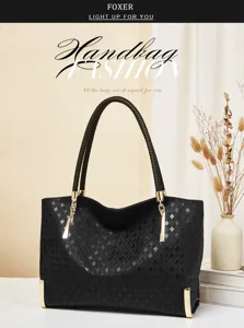 Elegant black genuine leather women handbag, woven shoulder strap, gold hardware detail.