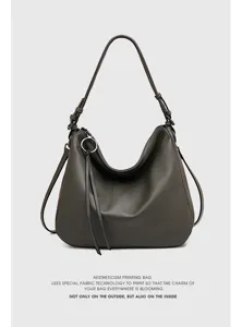 Dark gray leather hobo shoulder bag with sleek minimalist design and metal zipper detail.