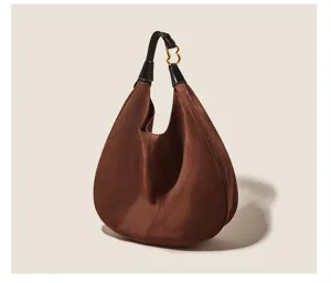 Detailed shot of retro brown suede hobo shoulder bag, large capacity stylish underarm bag.