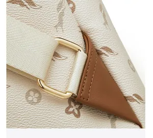 Detailed view of women casual commuter fashion lightweight monogram backpack with hardware.