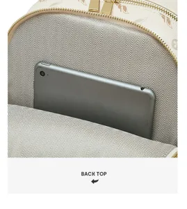 Backpack interior detail showing spacious compartment lining and phone pocket storage space.
