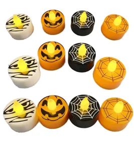 Close-up details of various Halloween LED tea light candles with cute pumpkin and web patterns.