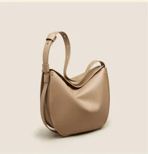 Soft leather slouchy hobo shoulder bag detail, casual minimalist daily commuter purse.