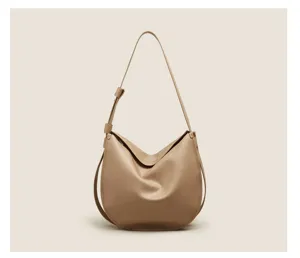 Soft leather hobo bag detail, casual slouchy design with adjustable strap, khaki.