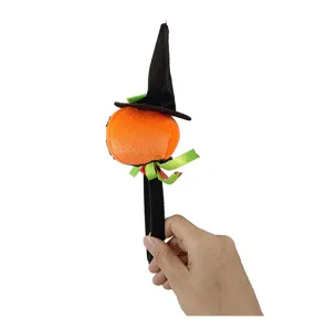 Close up view of the Halloween plush pumpkin witch hat headband detail showing cute design.