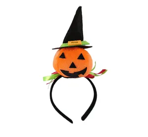 Close-up detail view of the cute Halloween pumpkin witch hat headband, plush party prop.