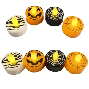 Halloween LED tealight candles detail view showing pumpkin and spider web designs for party decor.