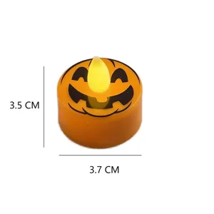 Close-up detail of the mini Halloween pumpkin LED tealight candle, showing glowing design.