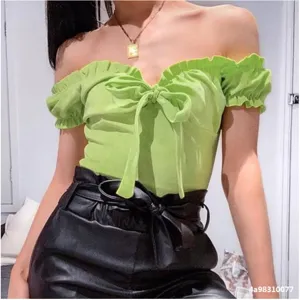 Bright green off-shoulder short sleeve bodysuit with ruffle trim and front bow detail.