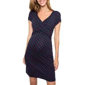 Maternity nursing dress with short sleeves, V-neck design and red polka dots on dark blue fabric.