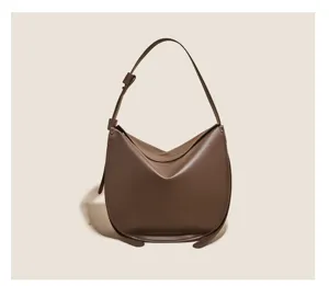 Brown soft leather hobo shoulder bag with minimalist lazy style and adjustable strap.