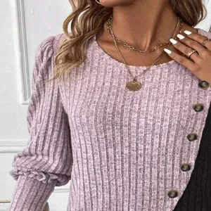 Detailed view of women long sleeve ribbed knit t-shirt with crew neck and button side.