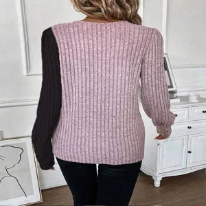 Detailed view of ribbed knit sweater featuring color-block sleeves and stylish back design.