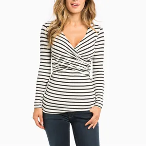 Detailed view of the black and white striped long sleeve V-neck top fabric texture.