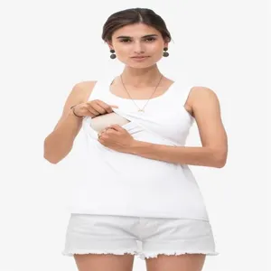 Detail of white sleeveless nursing tank top with double layer design for convenient breastfeeding.