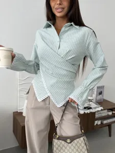 Detail view of women's striped wrap long-sleeve shirt featuring elegant lace trim.