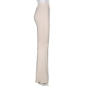 Side view detail of solid color high waist flared casual pants, women's fashion apparel.
