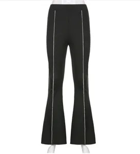 Detail view of women's black flare pants featuring shiny silver side piping and high waist.