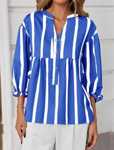 Blue and white vertical striped blouse featuring a V-neck, buttons, and chic puff sleeves.