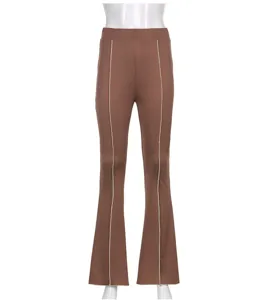 Women's brown casual solid color flare pants with front line detail, regular fit trouser style.
