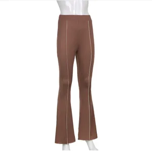 Brown micro flare trousers detail view showcasing the slim fit and front seam design.