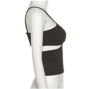 Close-up detail view of the stylish black ribbed cutout crop top showing side waist design.