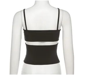 Detailed view of the black ribbed backless crop top, highlighting the slim fit and straps.