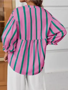 Detail view of the pink and green striped balloon sleeve blouse back design and fabric.