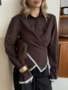Elegant striped cinched waist long sleeve blouse for women with chic lace trim and wrap design.
