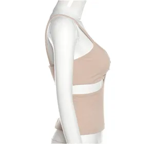 Side detail view of a beige ribbed camisole featuring a stylish cut-out under bust.