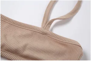 Close up detail of women ribbed camisole strap and collar texture, khaki summer top feature.