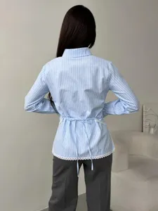 Blue white striped long sleeve shirt with back lace tie detail for women detail view.